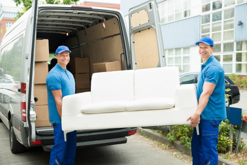 Team member loading moving items safely into a van