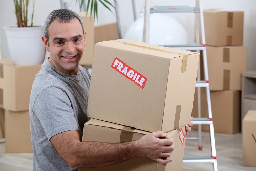 Flat removals planning in Claphampark with boxes and moving checklist