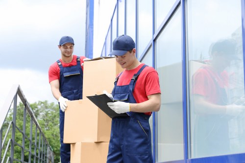 Staff preparing equipment for an office move in Claphampark
