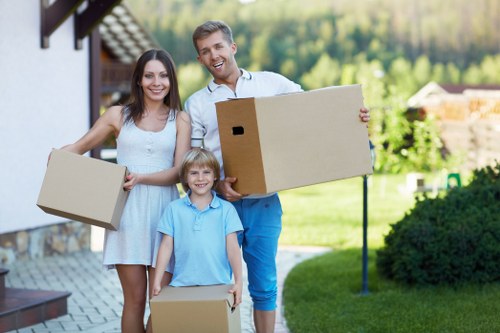 Professional movers loading furniture for same day removals