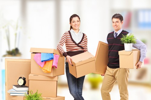 Professional removal van loading boxes in Claphampark