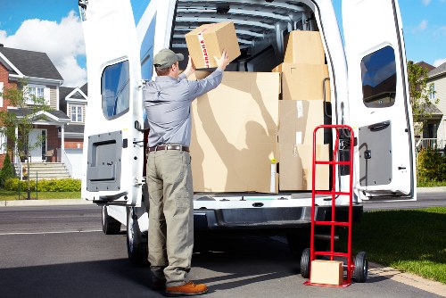 Piano removals in Claphampark with protective wrapping and loading