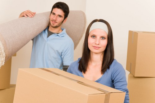 Van crew handling furniture during a local move