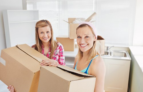 Careful loading of household items into a moving van