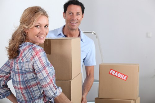 Packed office equipment ready for relocation services in Claphampark