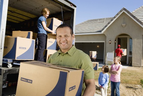Local moving team handling boxes and furniture in Clapham Park